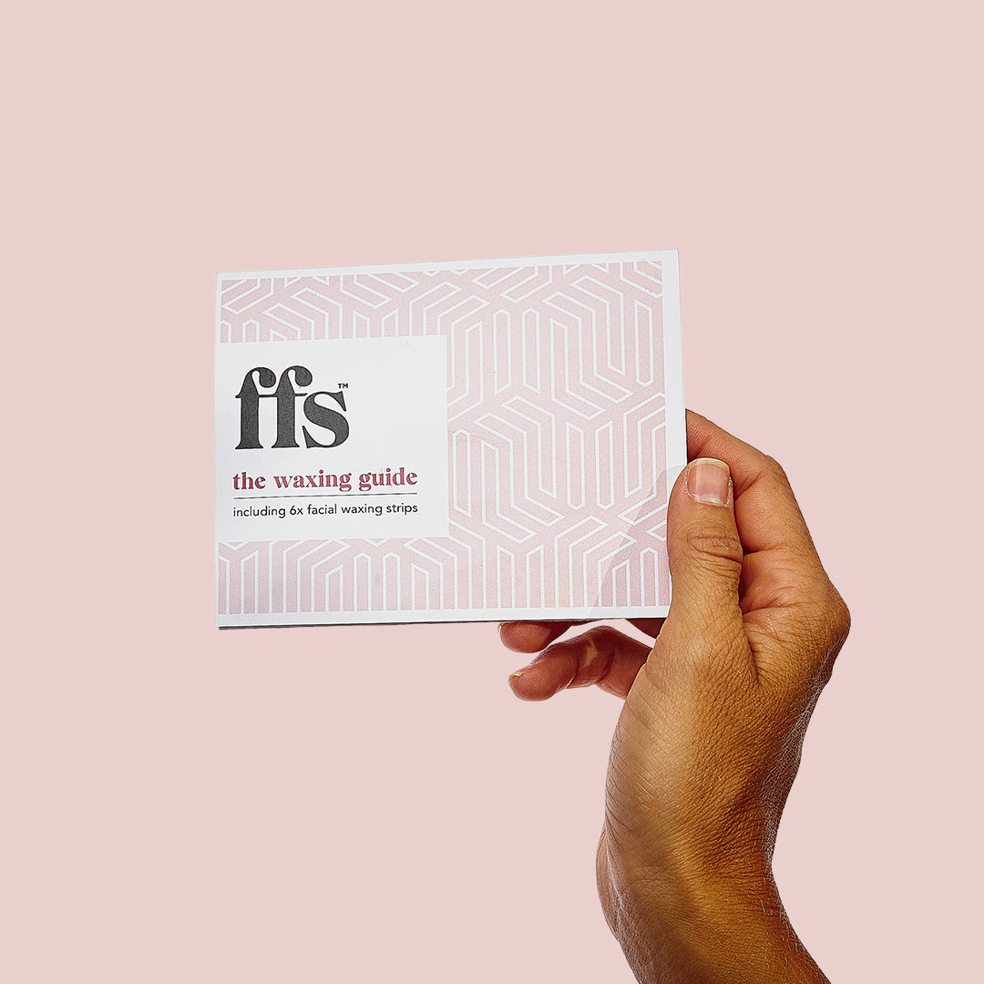 Woman holding an FFS waxing guide